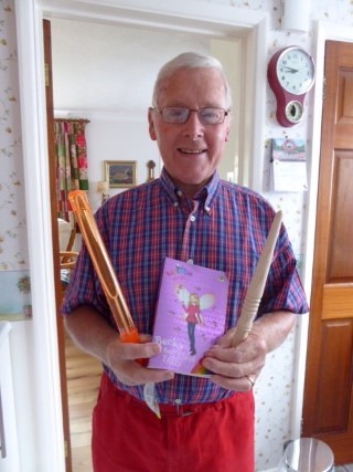 Keith with his wand and his winners prize. Ummm, a book on magic fairies and a bubble blowing wand err, well yes